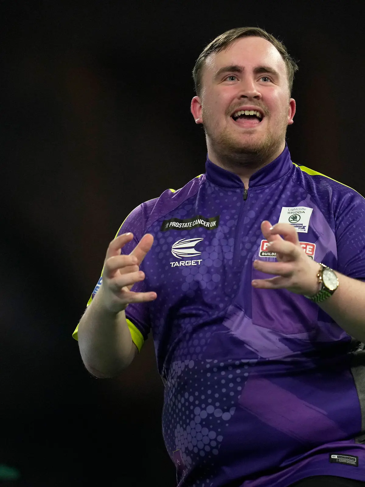 Luke Littler gestures during the final match against Luke Humphries of England at the World Darts Championship, in London, Wednesday, Jan. 3, 2024. (AP Photo/Kin Cheung)