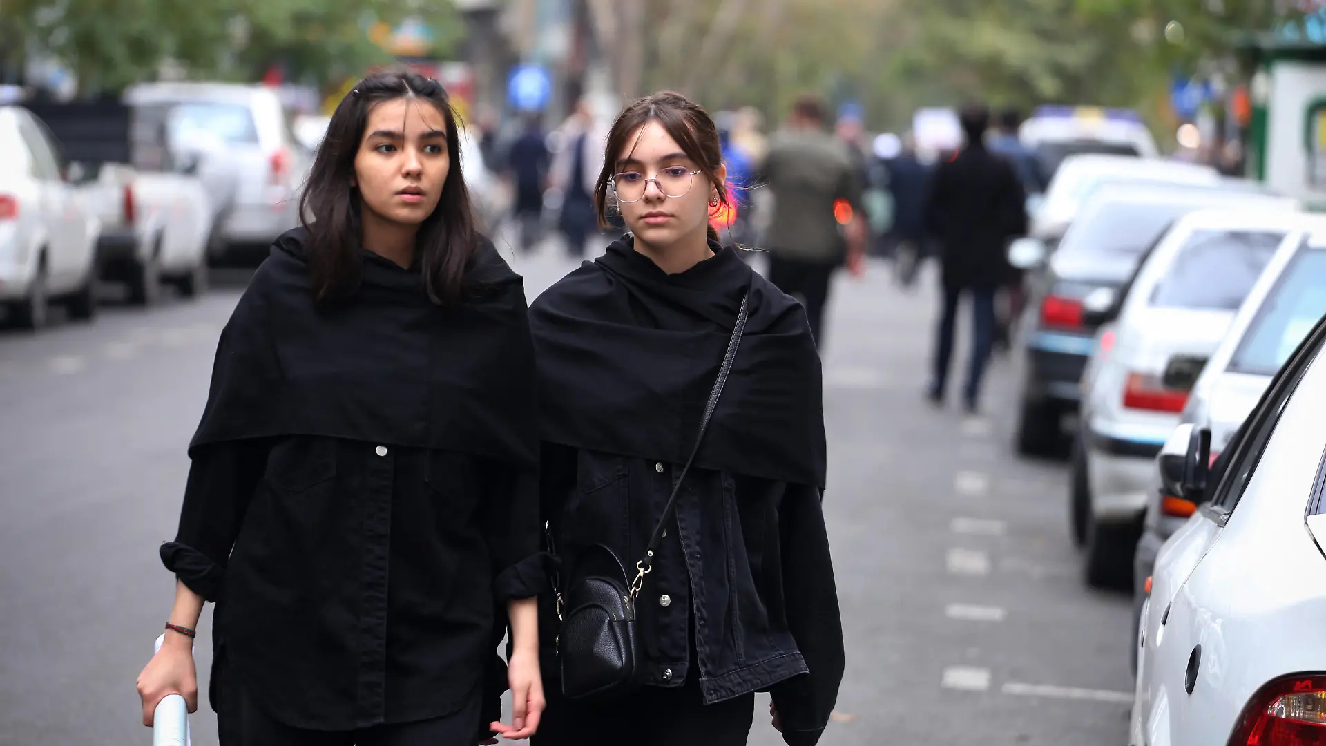 October 13, 2023, Tehran, Iran: Two Iranian schoolgirls without covering their mandatory Islamic headscarf walk at Palestine street in downtown Tehran. The Iranian government openly supported the Hamas attack on Israel and urged the Muslim community to stand by the Palestinians. Hundreds of Israelis and Palestinians have died after the militant group Hamas launched an unprecedented attack on Israel from the Gaza Strip on 07 October 2023. (Credit Image: © Rouzbeh Fouladi/ZUMA Press Wire