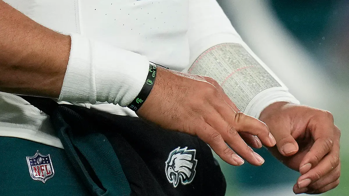 Philadelphia Eagles quarterback Jalen Hurts (1) walks off the field with a finger injury during the second quarter of an NFL football game against the New York Giants, Sunday, Jan. 7, 2024, in East Rutherford, N.J. (AP Photo/Seth Wenig)