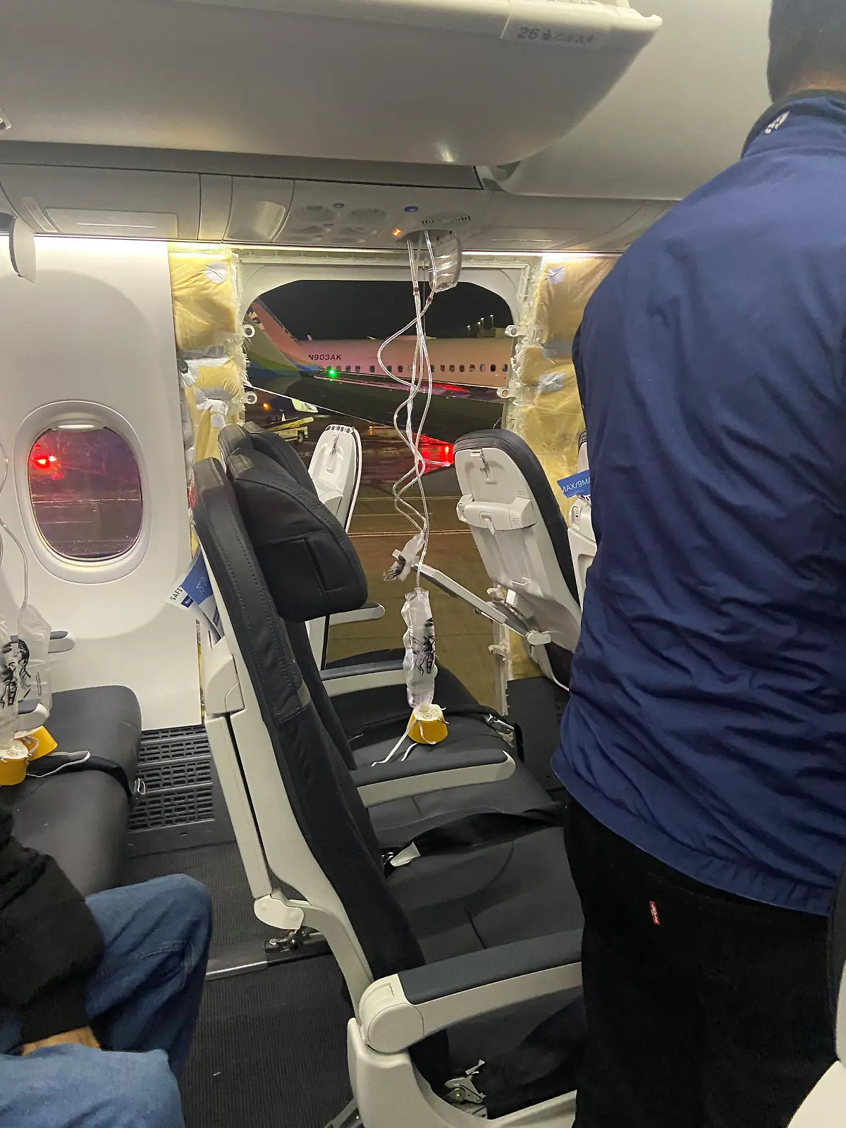 Passenger oxygen masks hang from the roof next to a missing window and a portion of a side wall of an Alaska Airlines Flight 1282, which had been bound for Ontario, California and suffered depressurization soon after departing, in Portland, Oregon, U.S., January 5, 2024 in this picture obtained from social media. Kyle Rinker via X/via REUTERS  THIS IMAGE HAS BEEN SUPPLIED BY A THIRD PARTY. MANDATORY CREDIT. NO RESALES. NO ARCHIVES.
