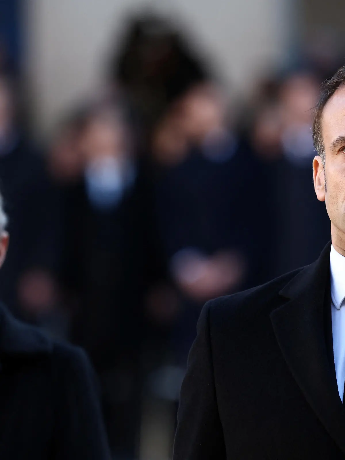 French President Emmanuel Macron and French Prime Minister Elisabeth Borne review troops during a national tribute ceremony for late French politician and former European Commission President Jacques Delors in the courtyard of the Hotel des Invalides in Paris, France, January 5, 2024. REUTERS/Stephanie Lecocq/Pool