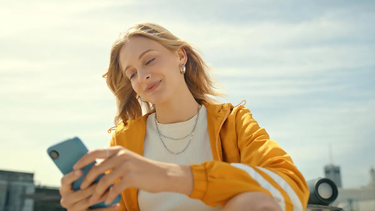 Phone, city and trendy woman on mobile app, chatting or texting for 5g networking, young fashion blog or social media. Streetwear student or gen z person on smartphone, cellphone and internet outdoor