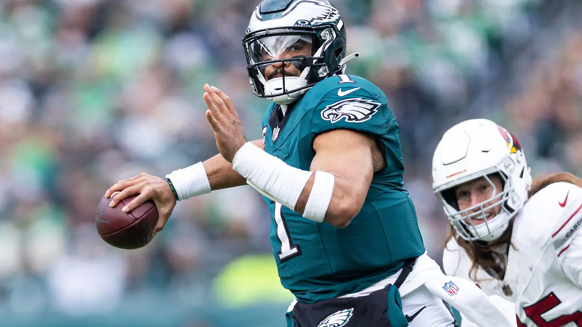 Dec 31, 2023; Philadelphia, Pennsylvania, USA; Philadelphia Eagles quarterback Jalen Hurts (1) passes for a touchdown during the second quarter against the Arizona Cardinals at Lincoln Financial Field. Mandatory Credit: Bill Streicher-USA TODAY Sports
