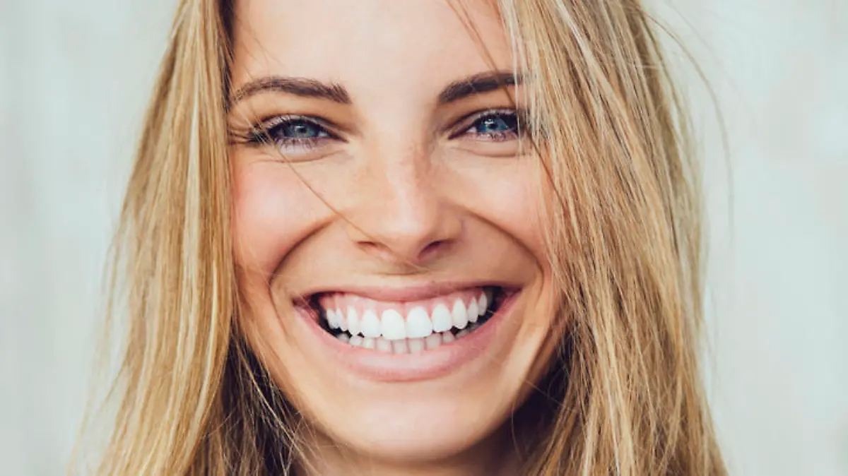 Portrait of young woman with beautiful smile
