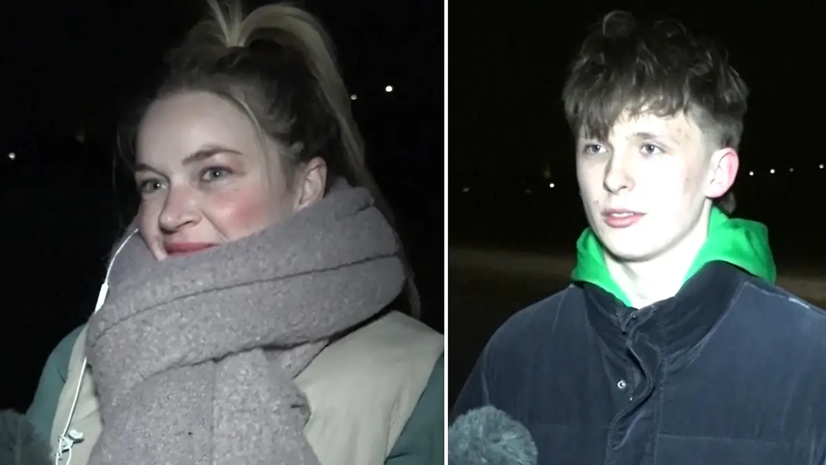 Eine Frau und ein Mann in Winterkleidung im Interview.