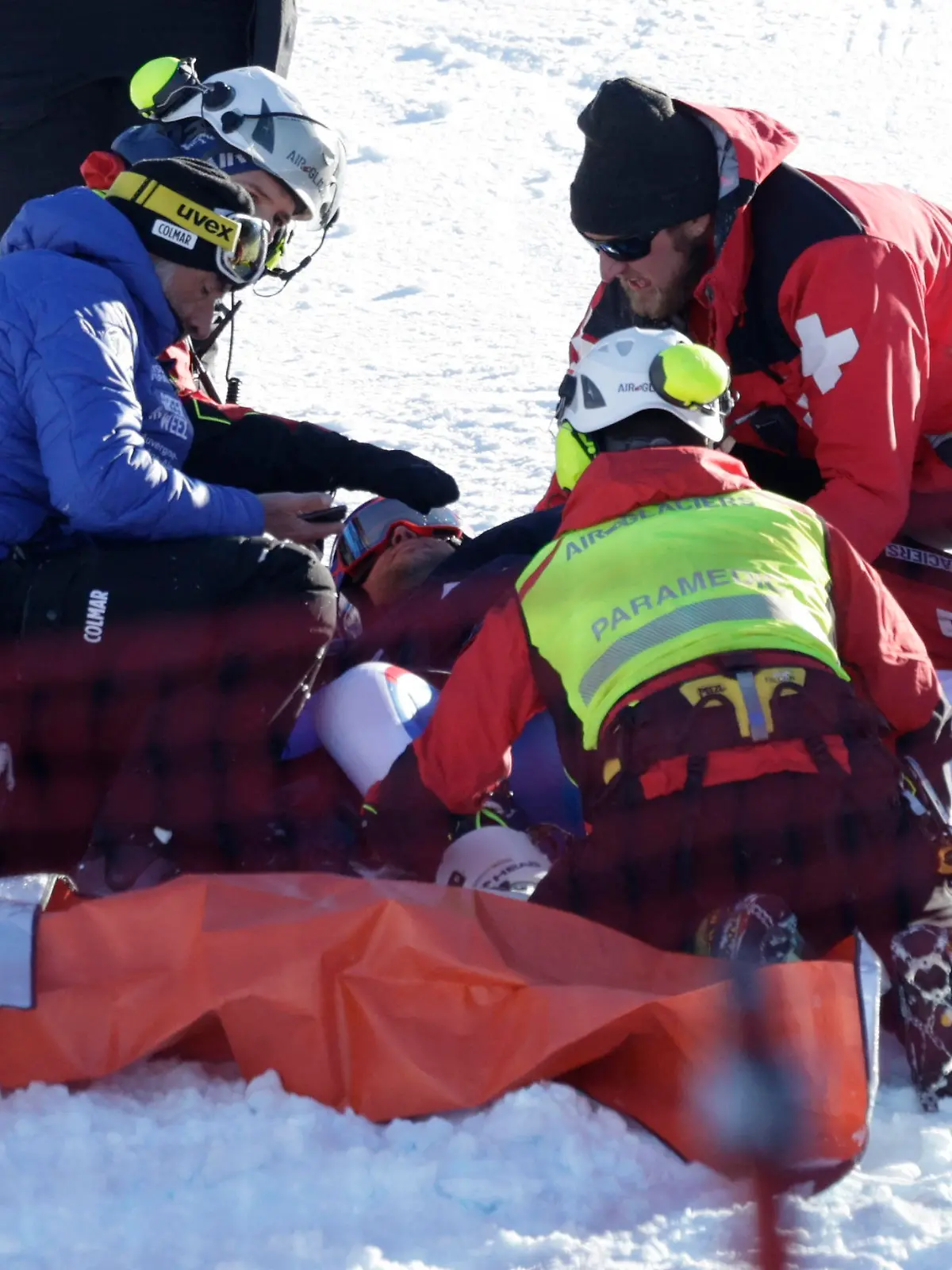Alpine Skiing - FIS Alpine Ski World Cup - Men's Super G - Wengen, Switzerland - January 12, 2024 France's Alexis Pinturault receives medical attention after crashing REUTERS/Leonhard Foeger