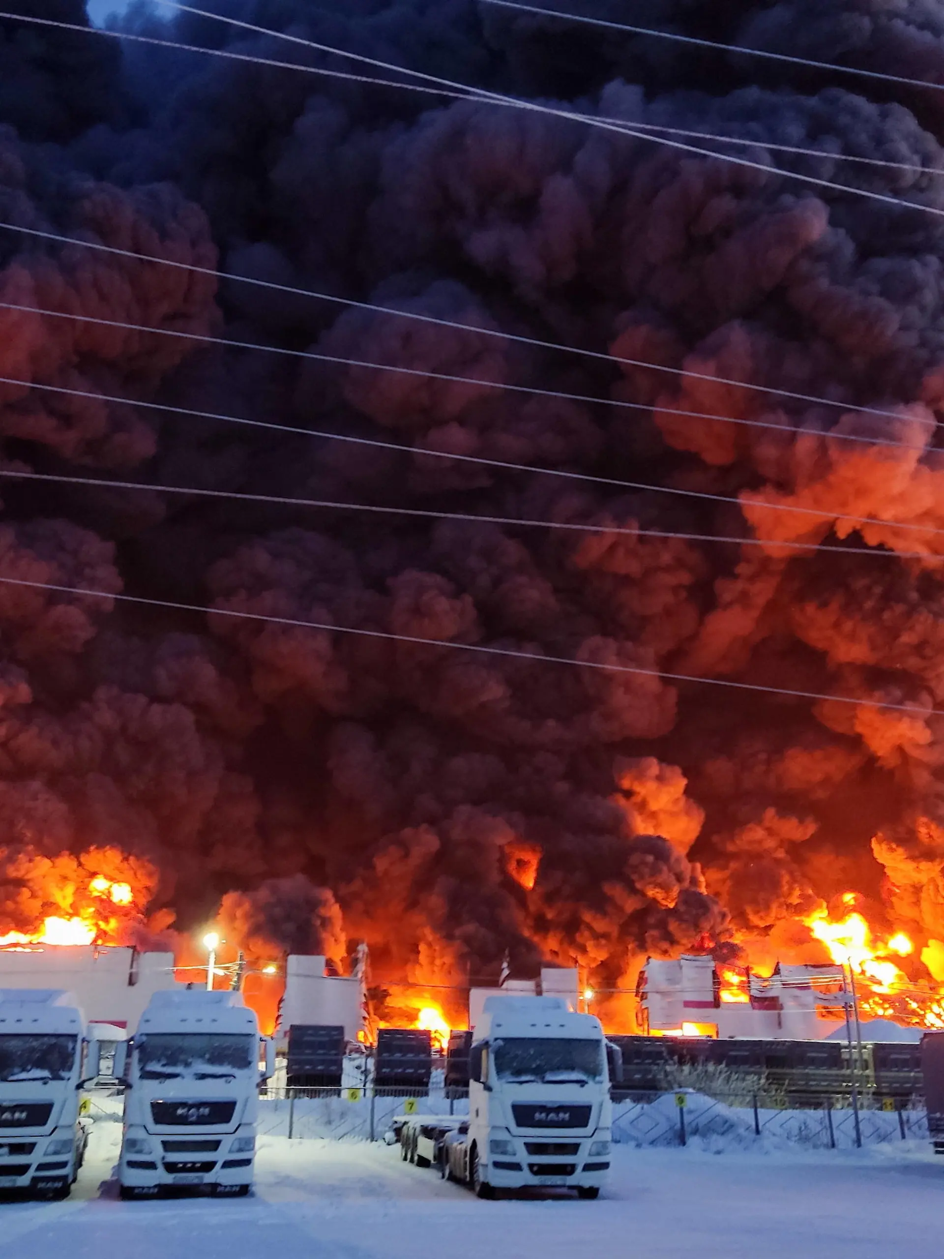 RUSSIA, ST PETERSBURG - JANUARY 13, 2024: A fire at a warehouse of the Wildberries online retailer in the village of Shushary. Ranked of maximum complexity, the fire has been contained on an area of 70,000 sqm no injuries reported. Pyotr Kostsov/TASS PUBLICATIONxINxGERxAUTxONLY 66391960