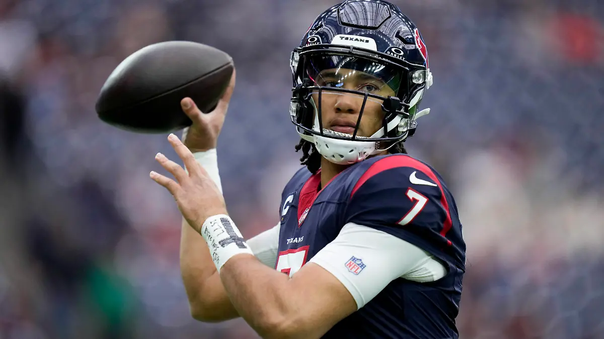 Houston Texans quarterback C.J. Stroud warms up before an NFL wild-card playoff football game between the Houston Texans and the Cleveland Browns Saturday, Jan. 13, 2024, in Houston. (AP Photo/Eric Christian Smith)