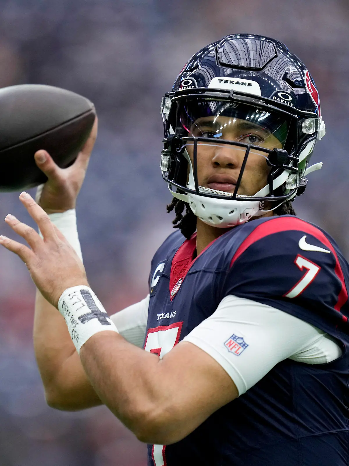 Houston Texans quarterback C.J. Stroud warms up before an NFL wild-card playoff football game between the Houston Texans and the Cleveland Browns Saturday, Jan. 13, 2024, in Houston. (AP Photo/Eric Christian Smith)
