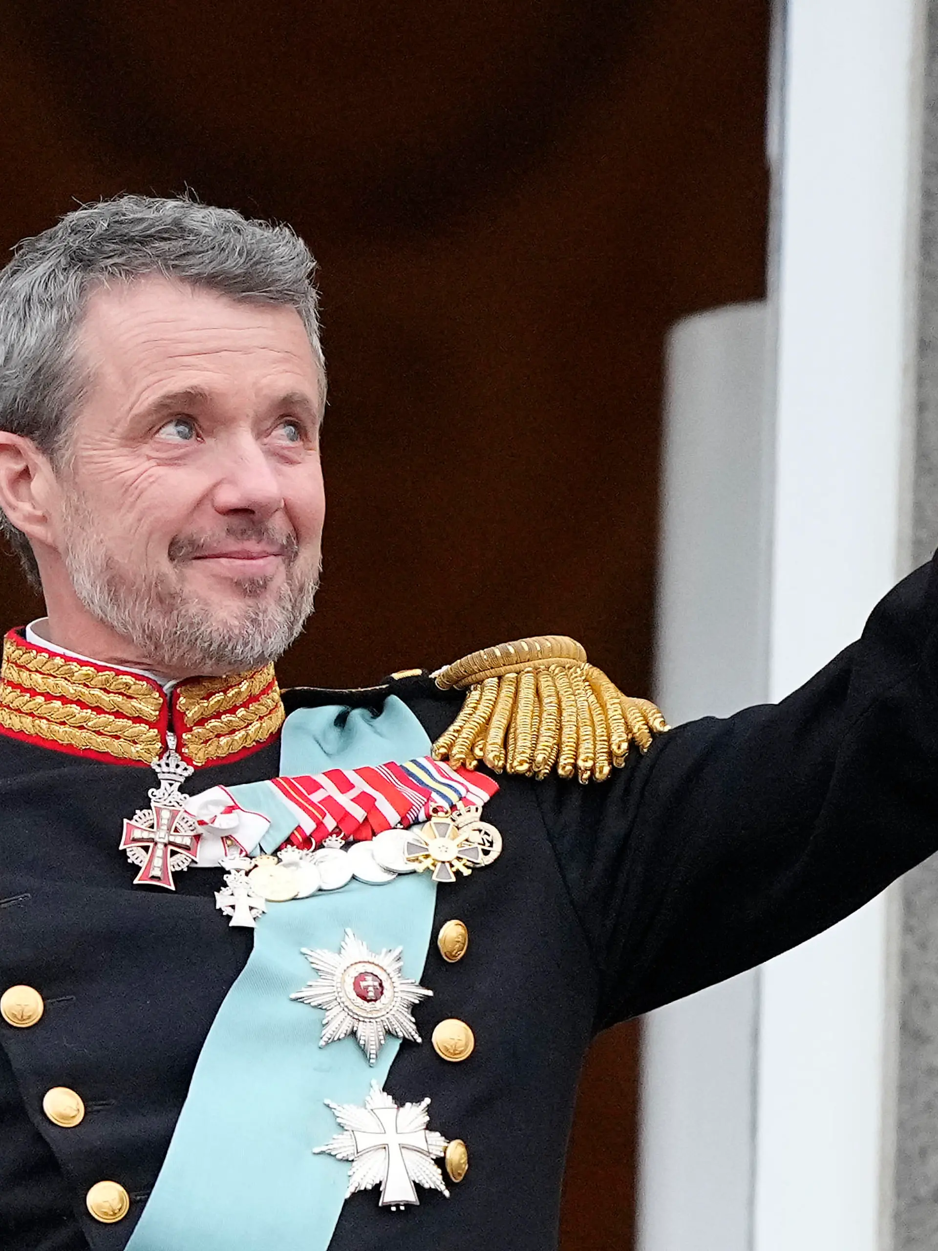 Denmark's King Frederik X waves from the balcony of Christiansborg Palace in Copenhagen, Denmark, Sunday, Jan. 14, 2024. Queen Margrethe II has become Denmark's first monarch to abdicate in nearly 900 years when she handed over the throne to her son, who has become King Frederik X. (AP Photo/Martin Meissner)