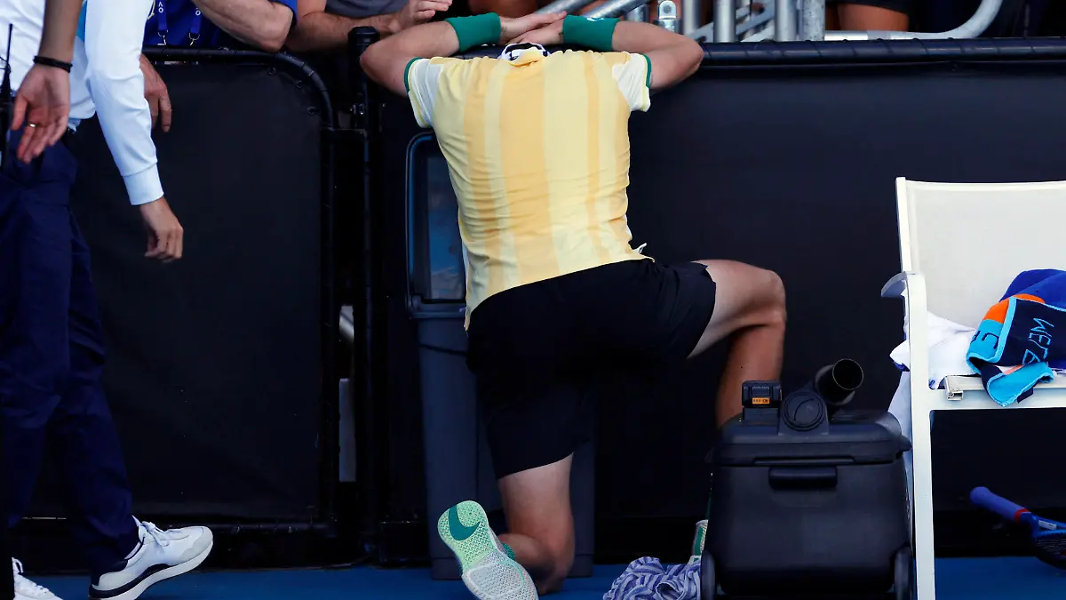 Tennis - Australian Open - Melbourne Park, Melbourne, Australia - January 16, 2024 Britain's Jack Draper appears to be ill as he celebrates winning his first round match against Marcos Giron of the U.S. REUTERS/Ciro De Luca