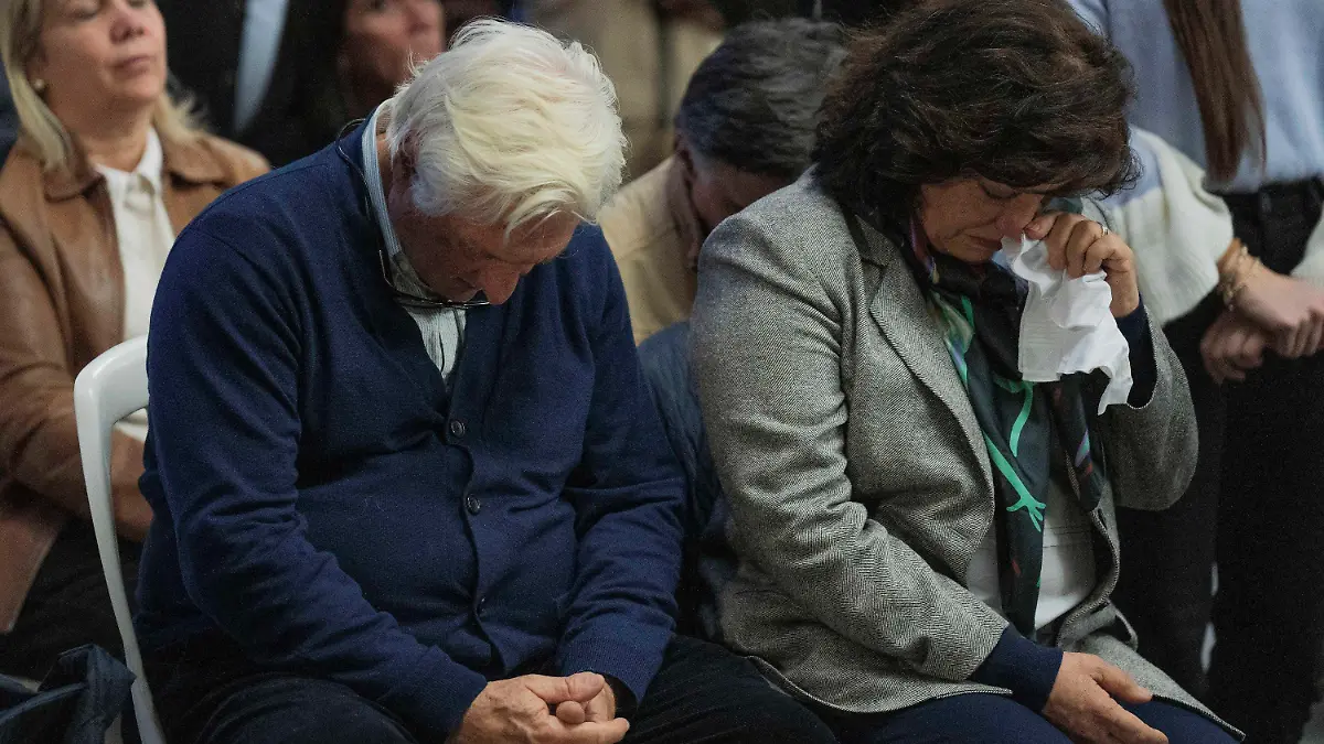 Roberto Canessa, former member of an Uruguayan rugby team who survived a 1972 plane crash in the Chilean Andes, and his wife Laura Surraco attend a Mass in remembrance of the accident in Montevideo, Uruguay, Thursday, Oct. 13, 2022. The former rugby players marked the 50 anniversary of the accident where only 16 of the original 45 passengers aboard survived. (AP Photo/Matilde Campodonico)