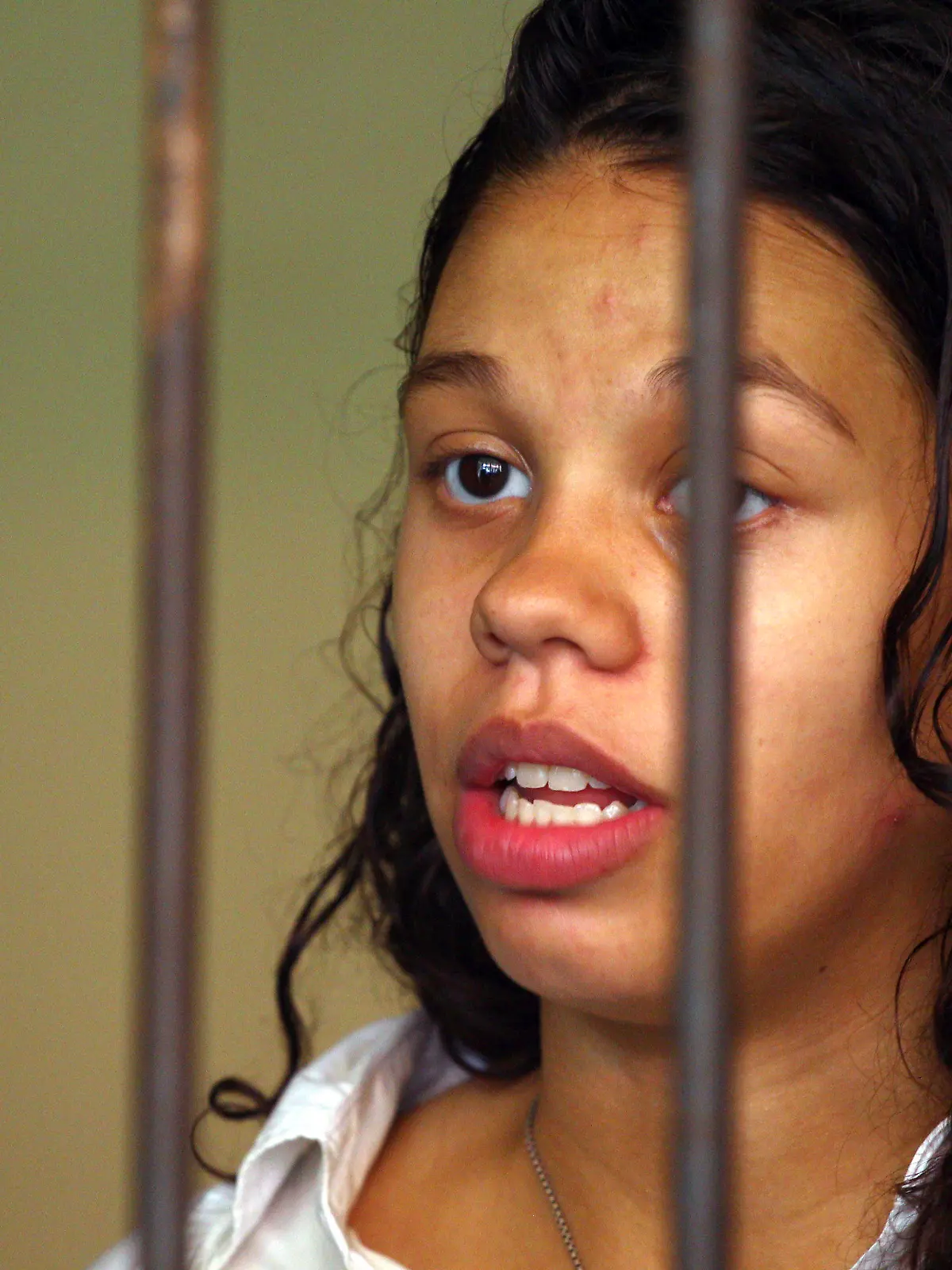 FILE - Heather Mack from Chicago, Ill., stands inside a cell before a trial in Bali, Indonesia, Wednesday, March 11, 2015.  Mack, who pleaded guilty to helping kill her own mother and stuffing the body in a suitcase during a luxury vacation in Bali was sentenced by a federal judge, Wednesday, Jan. 17, 2024, to 26 years in prison. (AP Photo/Firdia Lisnawati, File)
