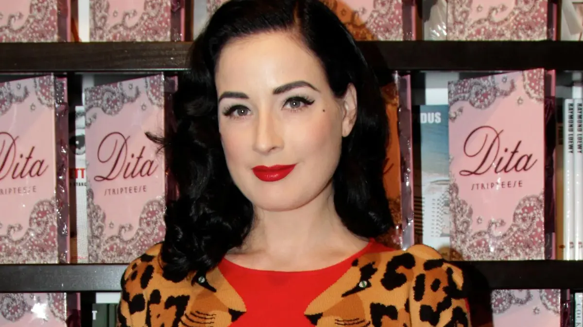 Dita Von Teese at a book signing for her book "Stripteese" at Books and Books on Miami Beach. Dita worse a tight fitting red and leopard print dress for her book signing.
<P>
Pictured: Dita Von Teese
<P>
<B>Ref: SPL143608 041209 </B><BR/>
Picture by: Pichichi / Splash News<BR/>
</P><P>
<B>Splash News and Pictures</B><BR/>
Los Angeles: 310-821-2666<BR/>
New York: 212-619-2666<BR/>
London: 870-934-2666<BR/>
photodesk@splashnews.com<BR/>
</P>