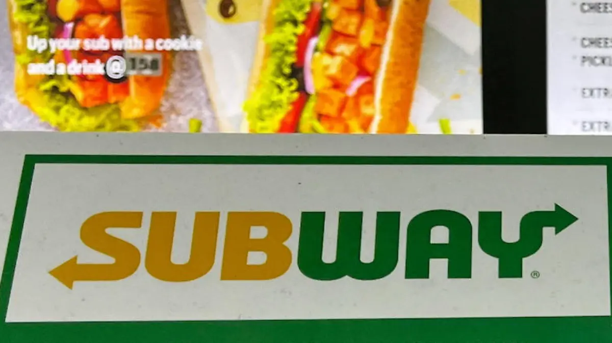 A notice on the temporary unavailability of tomatoes is seen at a Subway outlet at an airport terminal in New Delhi, India, July 22, 2023. REUTERS/Krishn Kaushik