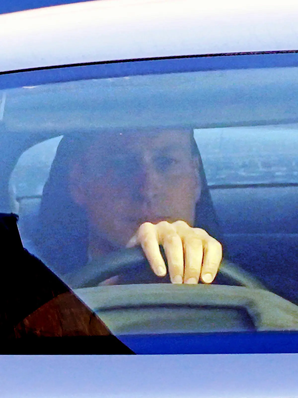 Britain's Prince William drives away from the London Clinic, in central London, where Kate, the Princess of Wales is recovering after undergoing successful abdominal surgery, Thursday Jan. 18, 2024. (Lucy North/PA via AP)