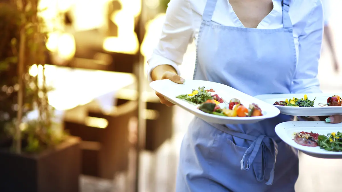Waitress wears food at work in the restaurant