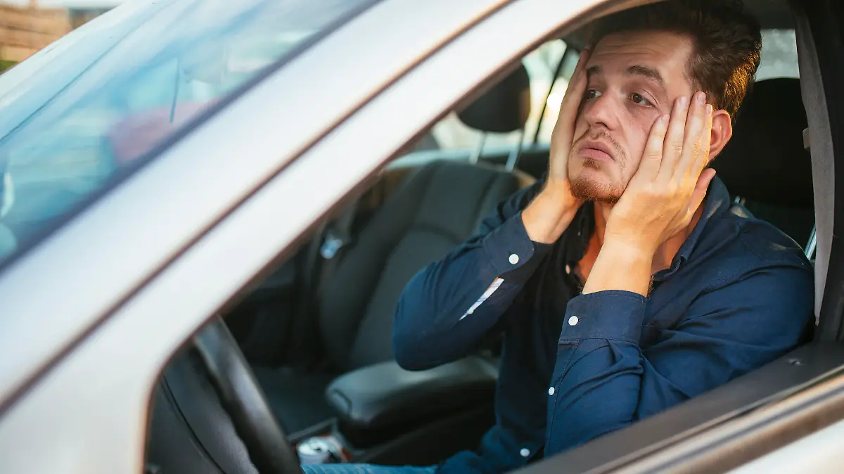 Desperate young driver, can't stand the traffic jam