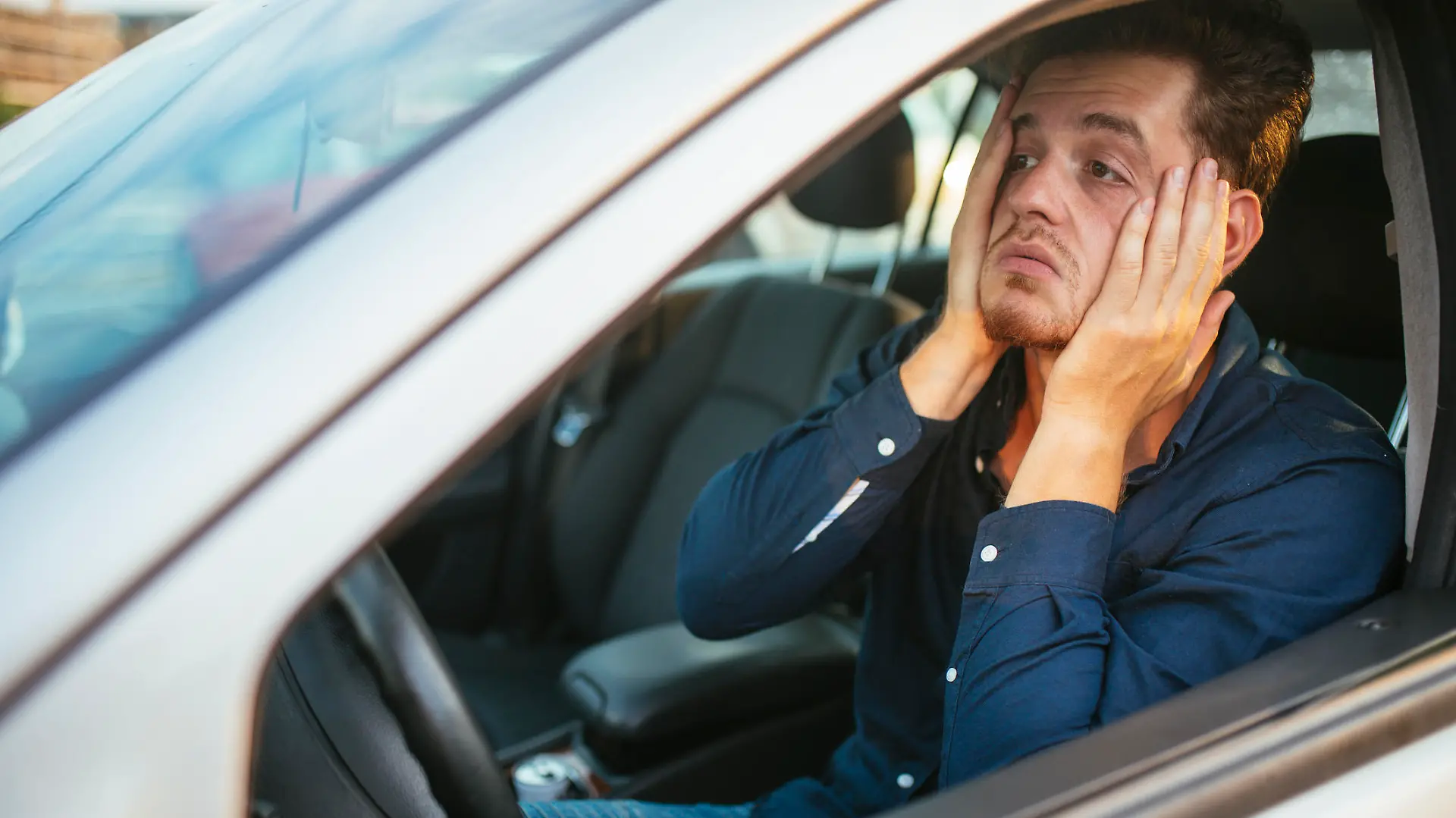 Desperate young driver, can't stand the traffic jam