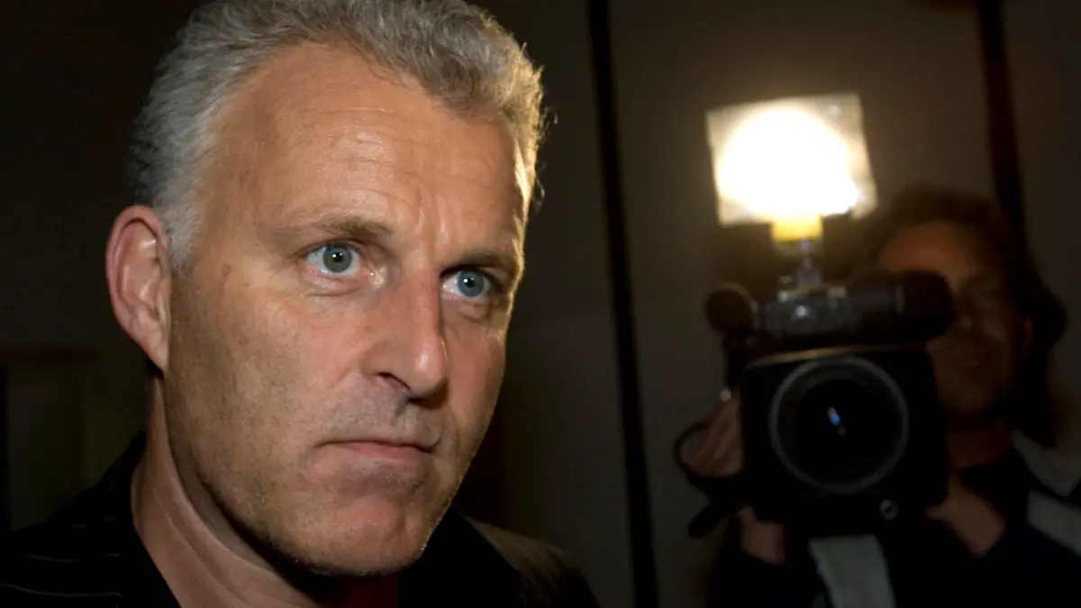 FILE - Dutch crime reporter Peter R. de Vries looks on, prior to attending a live TV show in Amsterdam, Netherlands, Thursday Jan. 31, 2008. Prosecutors say that two suspects in the slaying a year ago of Dutch crime reporter Peter R. de Vries have been arrested overseas, a day after the suspected “director” of the shocking killing was detained. The national prosecutor’s office said Tuesday, July 5, 2022 that a 27-year-old man was arrested on the former Dutch Caribbean colony of Curaçao and a 26-year-old man was detained in Spain. (AP Photo/Peter Dejong, File)