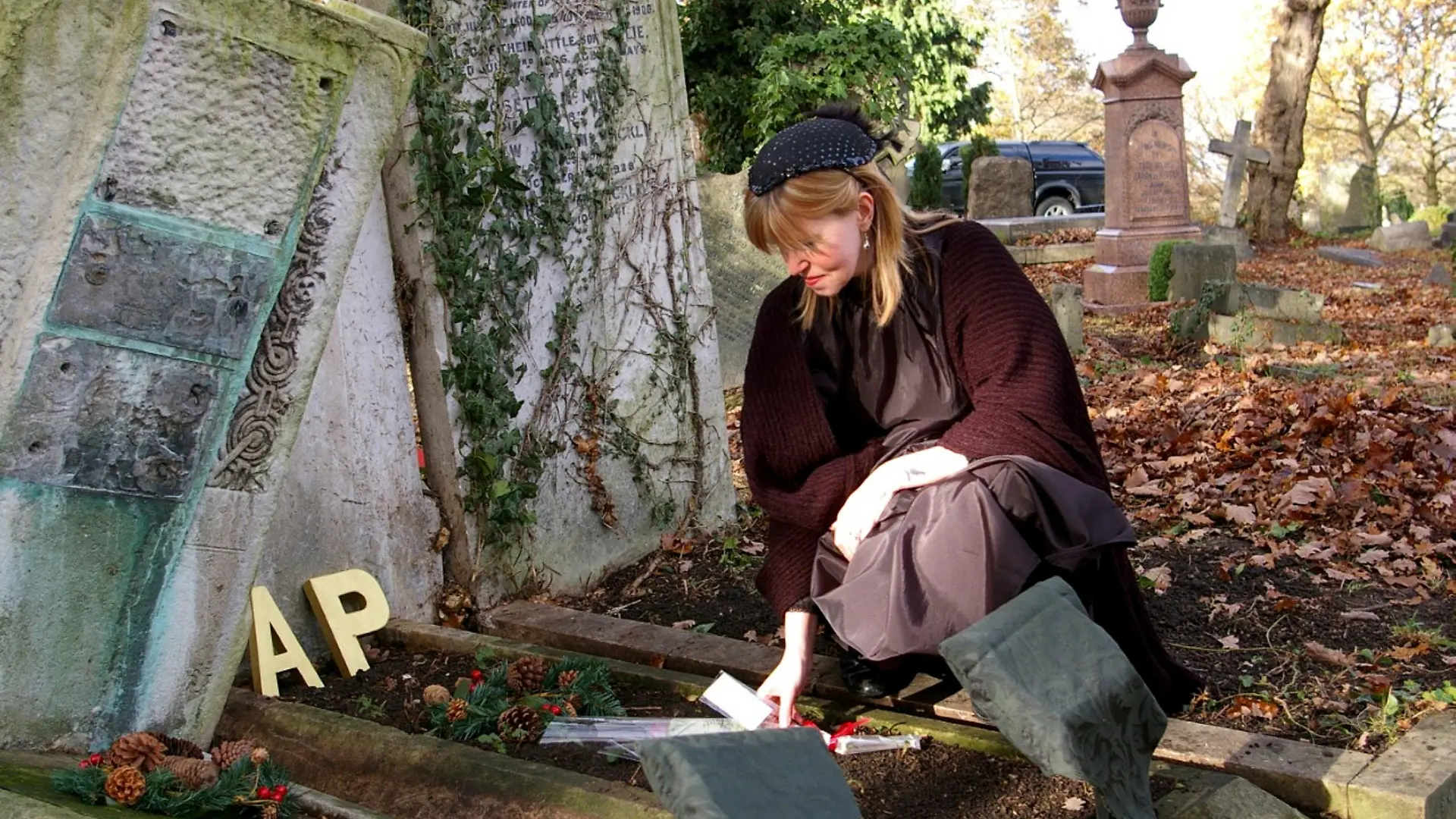 SONDERKONDITIONEN: Satzpreis!
Pictured Jeane at cemeteries. Meet the 'funeral crasher' fascinated with death and cemeteries - who has attended send offs for 200 strangers. See SWNS story SWFTfuneral. 
Meet the 'funeral crasher' fascinated with death and cemeteries - who has attended send offs for 200 strangers.
Jeane Trend-Hill, 55, has travelled around the world visiting cemeteries and began attending funerals after accidentally crashing one when she walked into a church when a service was going on in 2012.
After being a regular visitor to graves, cemetery workers at her local haunt started to contact Jeane when the deceased didn?t have any family or friends - to see if she could attend a funeral.
Now people contact her to ask her to join to make sure no one is cremated or buried alone. Jeane also spends hours photographing and tidying graves.
Jeane, an actress, photographer and artist, from Islington, London, said: ?I'm proud to be that person that goes to strangers funerals when there is no one else who can attend.
"I?ve always been fascinated with death since I was a child.
?We would go to cemeteries, and I?d walk around looking at all the graves.
?They are like outdoor art galleries.
?I accidentally walked in on a funeral at a church but raised as a Catholic I knew not to leave once there.
?Even though I didn?t know the person I was deeply moved.
?When cemetery workers started to invite me to services for veterans who had no one else to pay their respects I obliged and went along.
?I realised that everyone has a story to tell, everyone has lived a life and should have someone around to remember them when they die.?
Jeane lost her father, Joe, 56, when she was just 14 and her mother, Mary, 57, when she was just 20, and began to feel at home in cemeteries and crematoriums.
She would spend hours sketching and photographing London?s sprawling Victorian cemeteries and has visited graves all over the world like Paris and Venice.
?The first thing I do when I get somewhere is see where the closest crematory is,? she said.
?I did a PhD in mortuary science and became a cemetery historian.?
Jeane began attending funerals after she accidentally stumbled into one in 2012.
?I walked into this pretty church and realised a service was on,? she said.
?I was raised as a Catholic and told that it?s then bad to then leave, so I stayed and sat at the back.
?It was a complete stranger, but I was moved.
?Shortly after a cemetery worker reached out and asked if I?d attend a funeral for a veteran.
?Now I?ve attended nearly 200 funerals for people I don't actually know - although I have lost count of the exact amount.?
People reach out to Jean on Facebook to ask her to go along to send offs.
?No one should ever be cremated or buried alone,? Jeane said.
?If I?m asked and I can go I will.?
Jeane is still passionate for caring for graves and has even restored the plaque for British architect Arthur Beresford Pite and unveiled it in Victorian mourning dress.
Her family even joke and call her a 'rent a mourner'
"It's a name they gave me and it's a bit fun," she said.
"Of course I'd never actually make anyone pay for my attendance at a funeral.
?I?ll wear mourning dress to funerals if people ask me to.
?Death has never worried me.
?I hope I can make death feel less scary for people.
?It?s my way of giving something back.? / action press