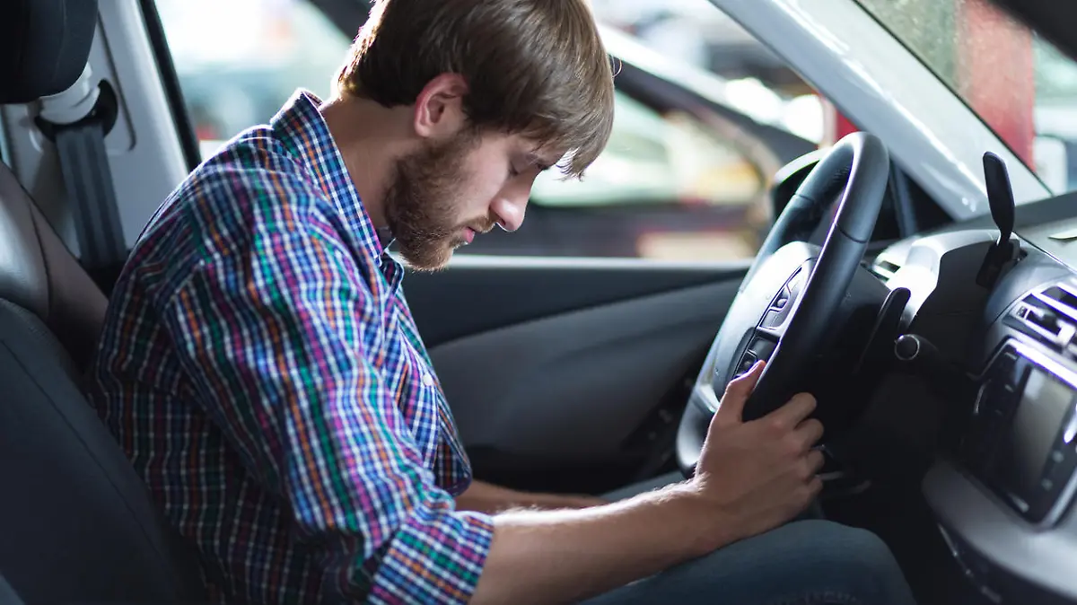 Young troubled driver having problem with car