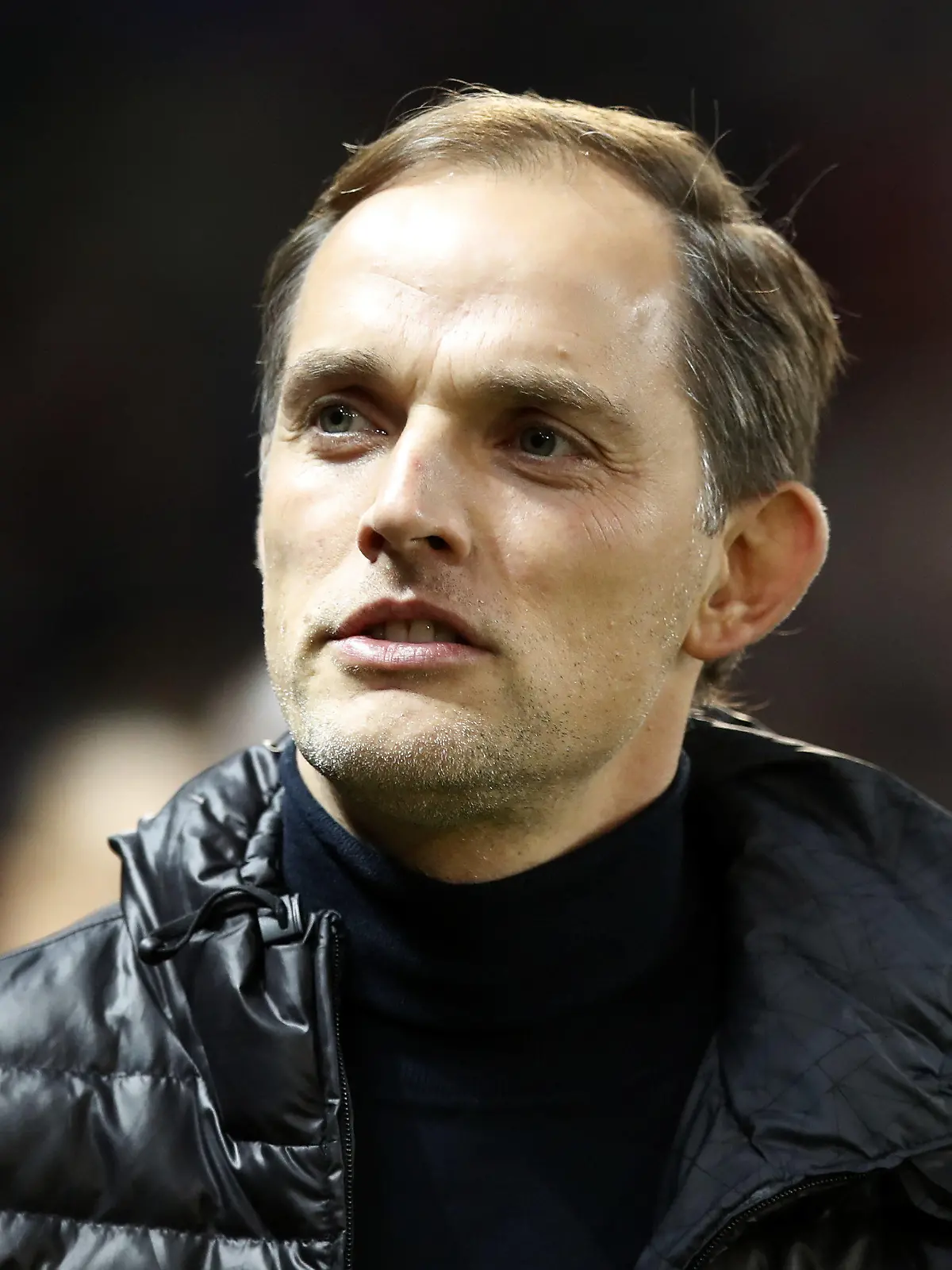 ARCHIV - 12.02.2019, Großbritannien, Manchester: Trainer Thomas Tuchel von Paris-Saint-Germain steht auf dem Platz. Der englische Fußball-Club FC Chelsea hat sich von Trainer Lampard getrennt. Übereinstimmenden Medienberichten zufolge soll Thomas Tuchel sein Nachfolger werden, eine offizielle Bestätigung dafür lag am Montag (25.01.2021) zunächst nicht vor. Foto: Martin Rickett/PA Wire/dpa +++ dpa-Bildfunk +++