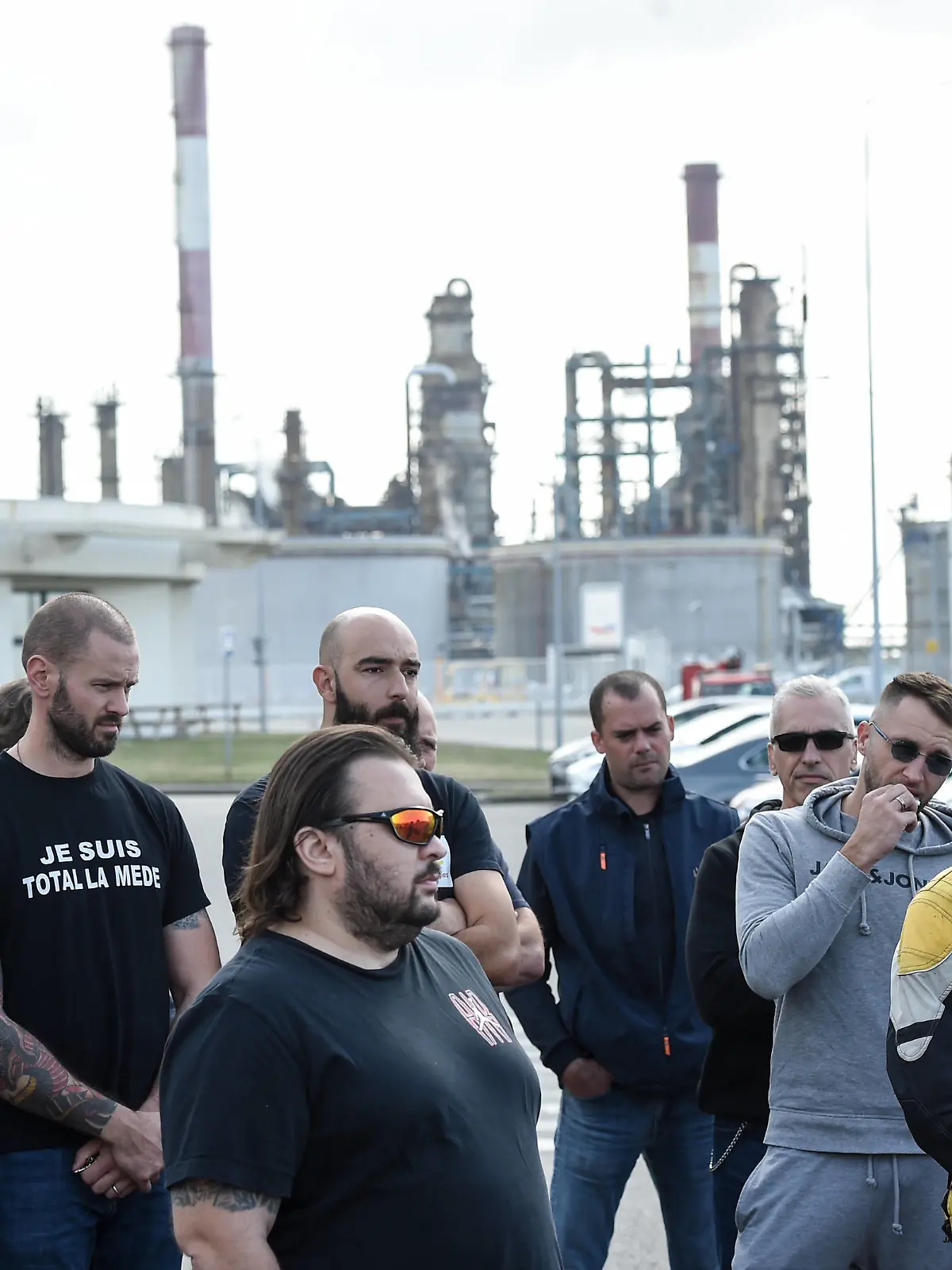 Trade unionists and striking employees gather outside the TotalEnergies refinery site, in Donges, western France, on October 12, 2022. France's Prime Minister announced on October 11, 2022 the requisition of staff to unlock the fuel depots of the group Esso-Exxonmobil, where a wage agreement was reached on October 10, 2022 by two trade unions, which have a majority at the group but not at its refineries.//SALOM-GOMIS_d010/2210121532/Credit:Sebastien SALOM-GOMIS/SIPA/2210121541