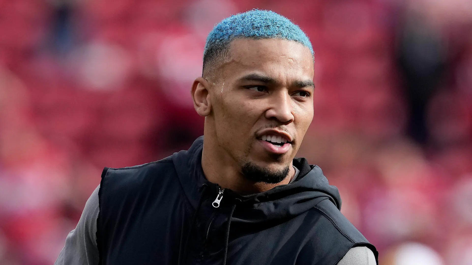 Detroit Lions wide receiver Amon-Ra St. Brown watches during warm ups before the NFC Championship NFL football game between the San Francisco 49ers and the Detroit Lions in Santa Clara, Calif., Sunday, Jan. 28, 2024. (AP Photo/Godofredo A. Vasquez)