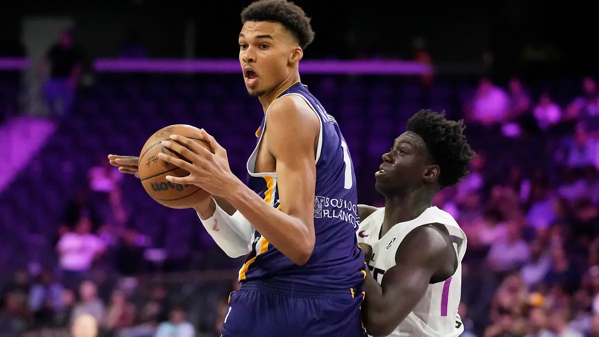 Boulogne-Levallois Metropolitans 92's Victor Wembanyama drives around NBA G League Ignite's Sidy Cissoko during the second half of an exhibition basketball game Tuesday, Oct. 4, 2022, in Henderson, Nev. (AP Photo/John Locher)