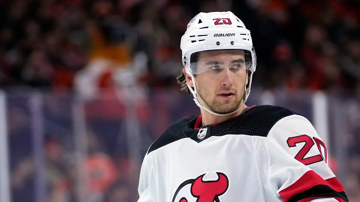 FILE - New Jersey Devils' Michael McLeod watches during a break in an NHL hockey game, Thursday, Nov. 30, 2023, in Philadelphia. McLeod has been charged in connection with an investigation into an alleged sexual assault by several members of Canada’s 2018 world junior team, his lawyers said Tuesday, Jan. 30, 2024. (AP Photo/Matt Slocum, File)