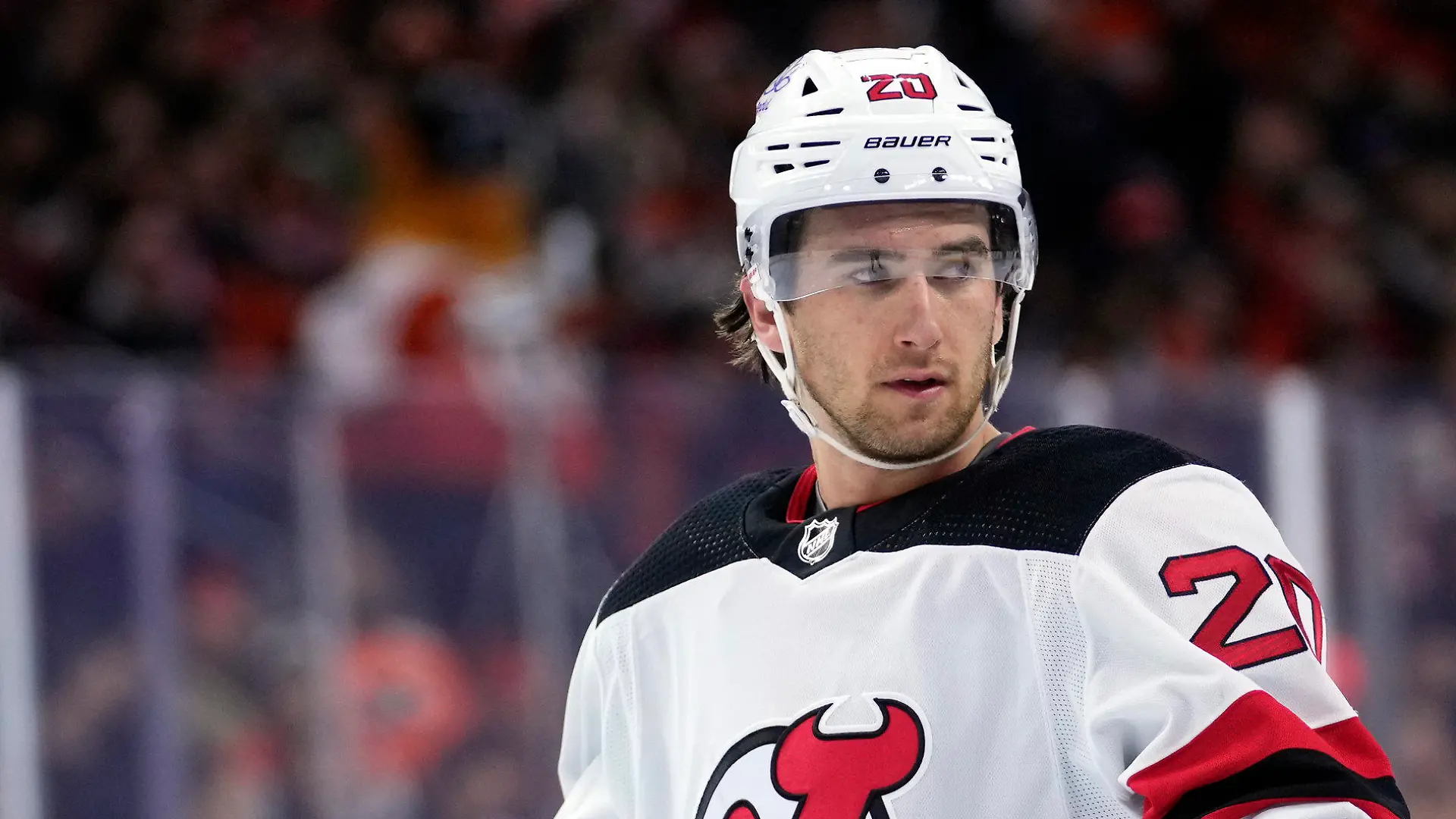 FILE -  New Jersey Devils' Michael McLeod watches during a break in an NHL hockey game, Thursday, Nov. 30, 2023, in Philadelphia. McLeod has been charged in connection with an investigation into an alleged sexual assault by several members of Canada’s 2018 world junior team, his lawyers said Tuesday, Jan. 30, 2024. (AP Photo/Matt Slocum, File)