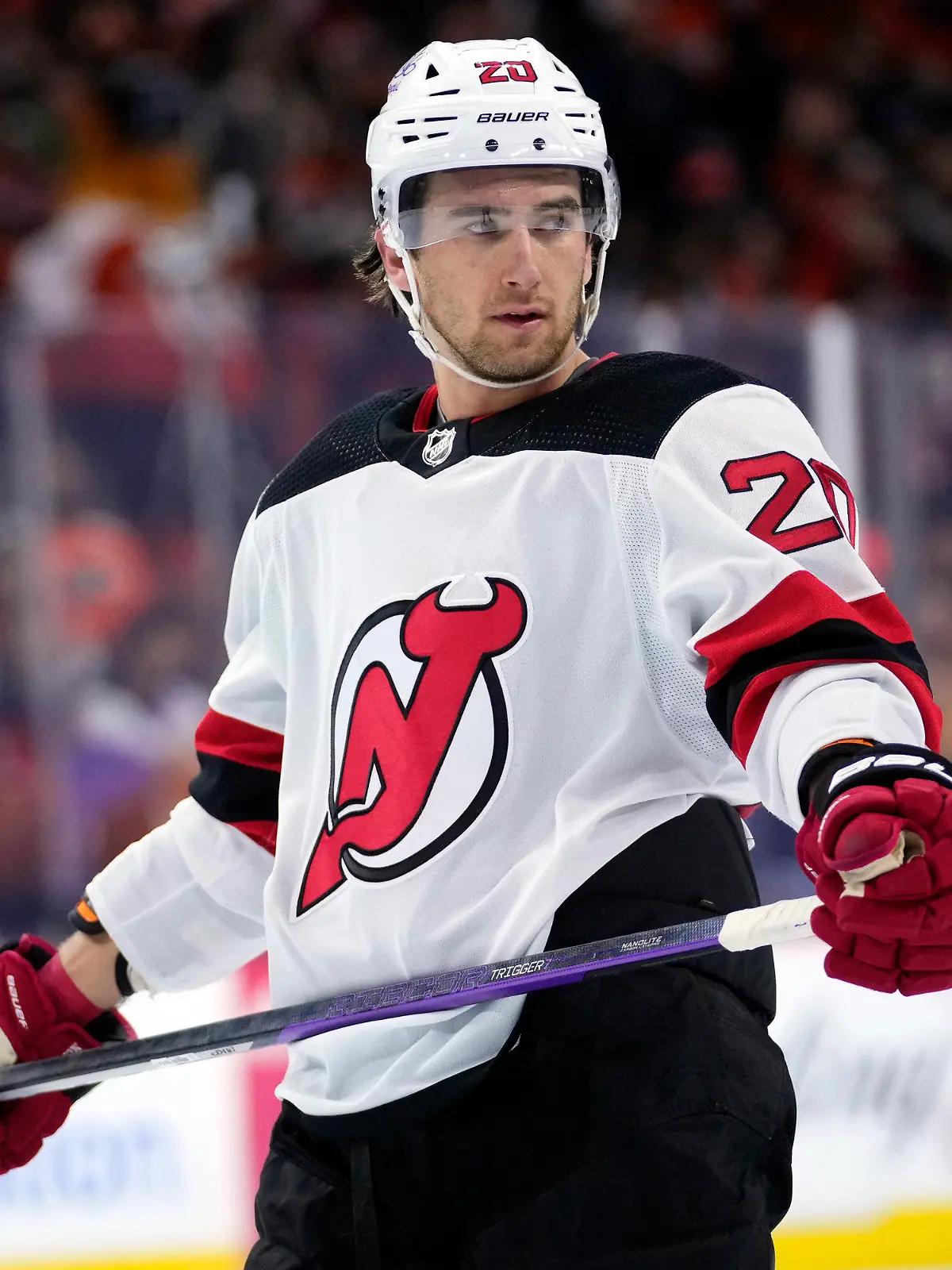 FILE -  New Jersey Devils' Michael McLeod watches during a break in an NHL hockey game, Thursday, Nov. 30, 2023, in Philadelphia. McLeod has been charged in connection with an investigation into an alleged sexual assault by several members of Canada’s 2018 world junior team, his lawyers said Tuesday, Jan. 30, 2024. (AP Photo/Matt Slocum, File)