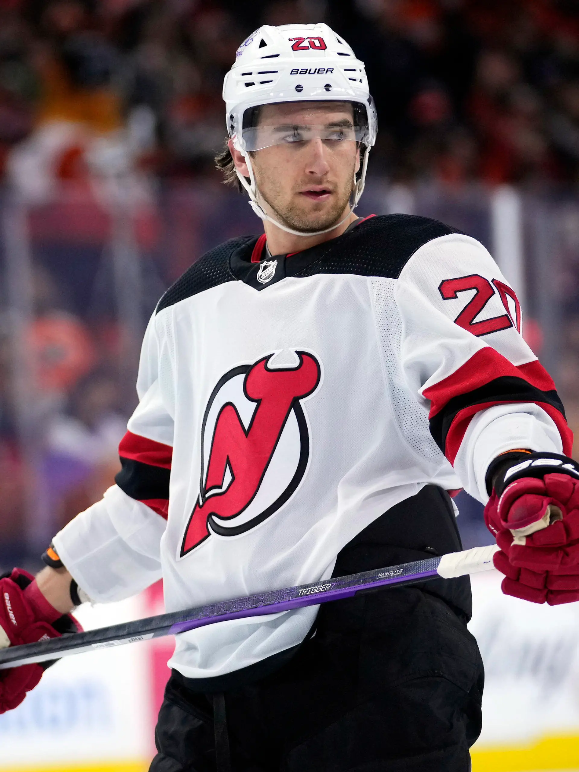 FILE -  New Jersey Devils' Michael McLeod watches during a break in an NHL hockey game, Thursday, Nov. 30, 2023, in Philadelphia. McLeod has been charged in connection with an investigation into an alleged sexual assault by several members of Canada’s 2018 world junior team, his lawyers said Tuesday, Jan. 30, 2024. (AP Photo/Matt Slocum, File)