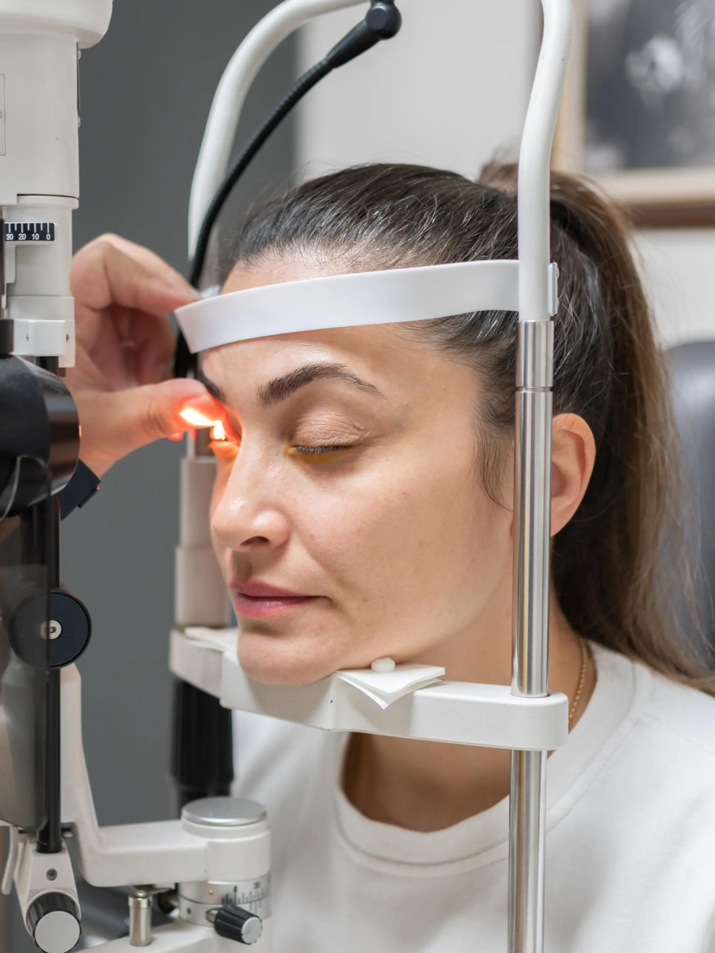 Ophthalmologist Checking The Eye Vision Of Female Patient At Clinic