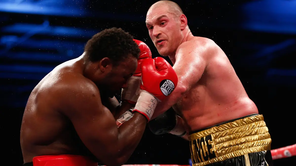 LONDON, ENGLAND - NOVEMBER 29:  Dereck Chisora of England fights Tyson Fury of England in the eliminator for the WBO World Heavyweight Championship during Boxing at ExCel on November 29, 2014 in London, England.  (Photo by Julian Finney/Getty Images)