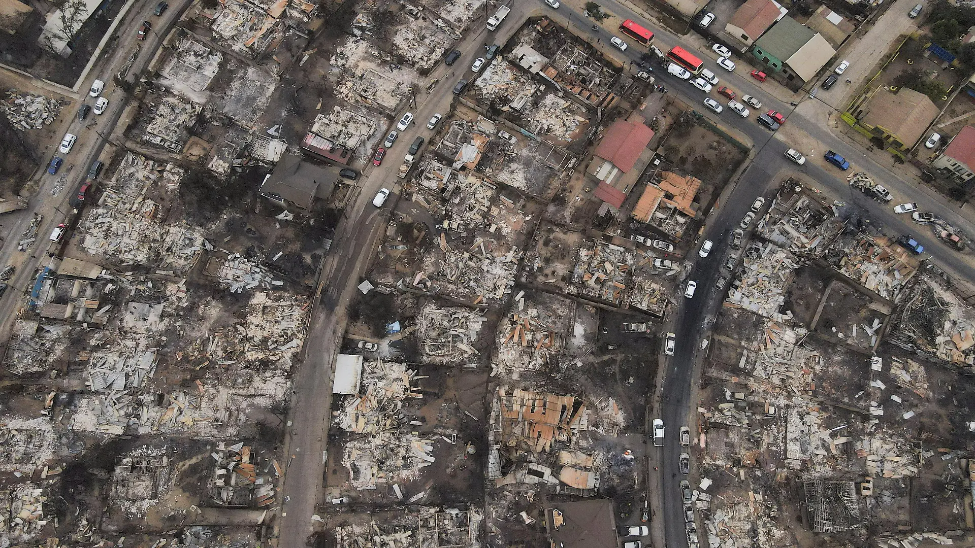 The remains of burned houses are seen, following the spread of wildfires in Vina del Mar, Chile February 4, 2024. REUTERS/ Sofia Yanjari