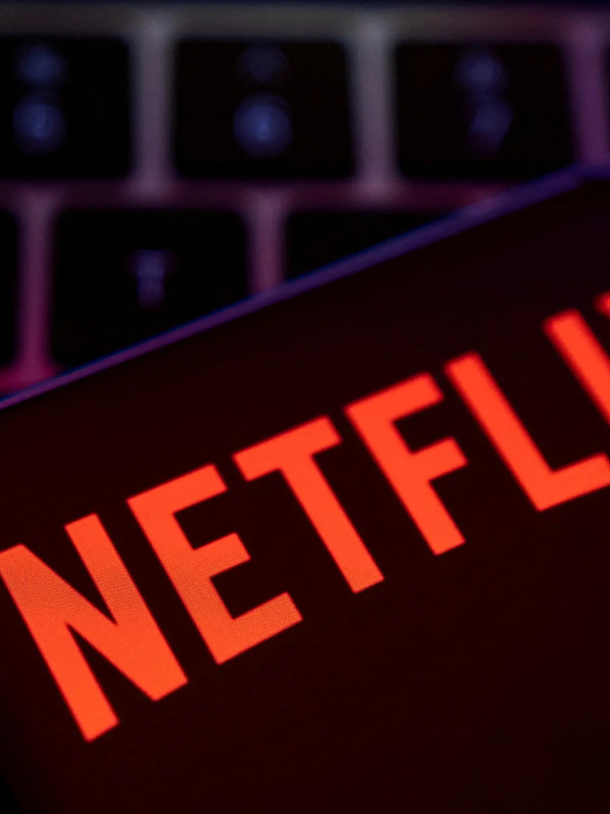 FILE PHOTO: Smartphone with Netflix logo is placed on a keyboard in this illustration taken April 19, 2022. REUTERS/Dado Ruvic/File Photo