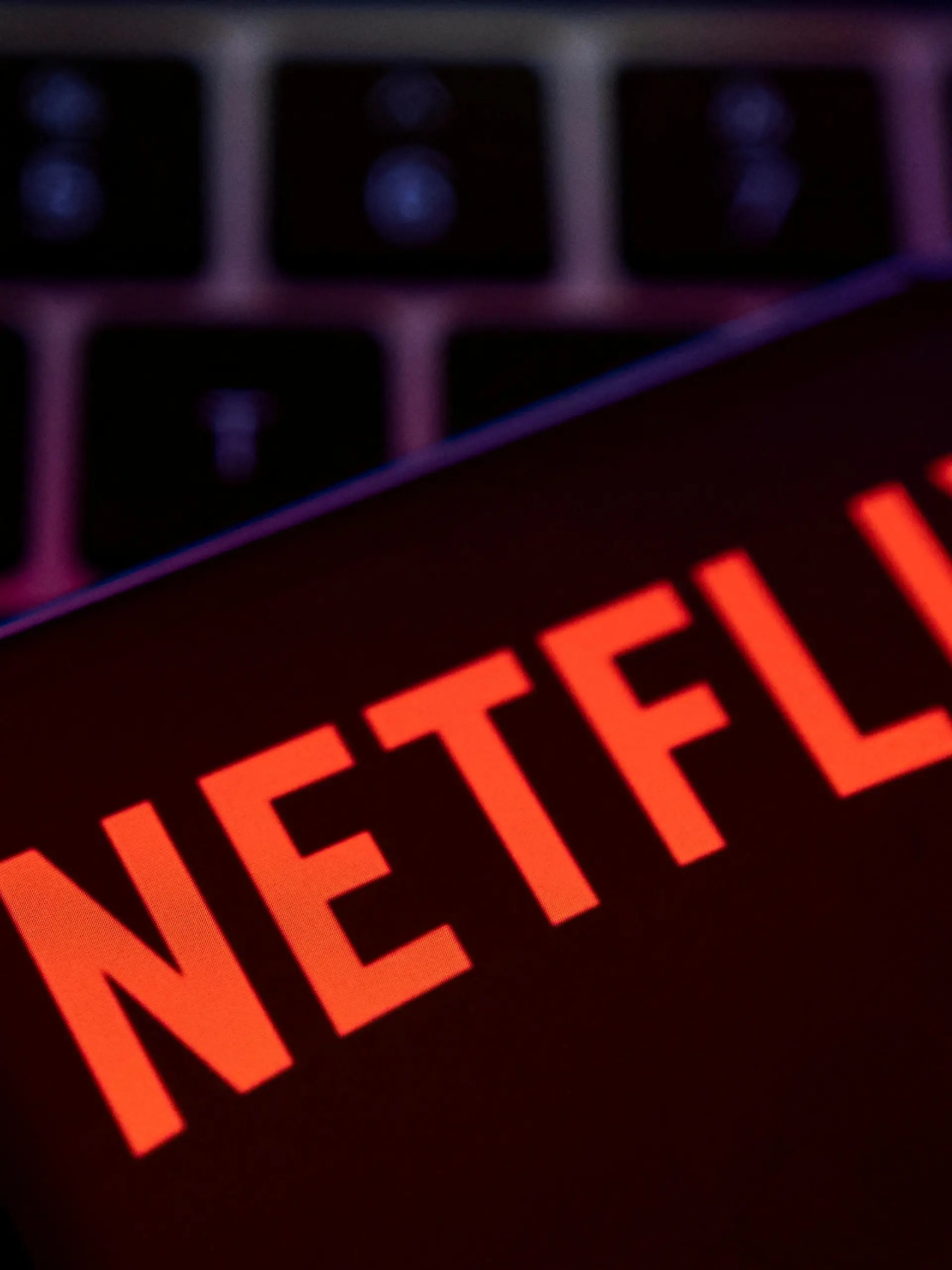 FILE PHOTO: Smartphone with Netflix logo is placed on a keyboard in this illustration taken April 19, 2022. REUTERS/Dado Ruvic/File Photo