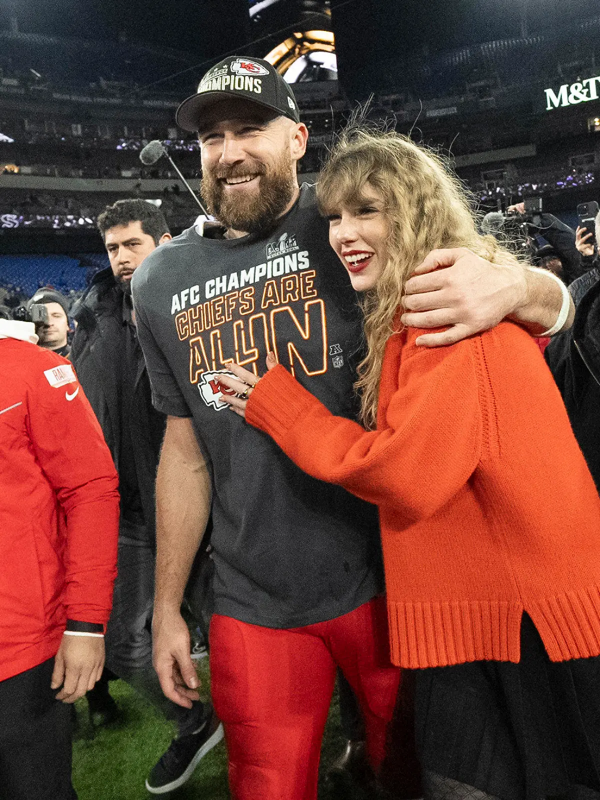 FILE - Kansas City Chiefs tight end Travis Kelce and Taylor Swift walk together after an AFC Championship NFL football game between the Chiefs and the Baltimore Ravens, Jan. 28, 2024, in Baltimore.. Taylor Swift, who is holding concerts in Japan, will make it in time for the Super Bowl to see her partner and football superstar Travis Kelce play. (AP Photo/Julio Cortez, File)