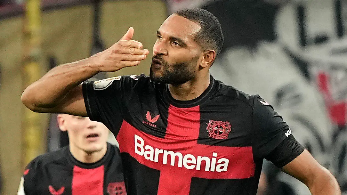 Leverkusen's Jonathan Tah celebrates after scoring his side's third goal during the German soccer cup quarterfinal match between Bayer 04 Leverkusen and VfB Stuttgart at the BayArena in Leverkusen, Germany, Tuesday, Feb. 6, 2024. (AP Photo/Martin Meissner)
