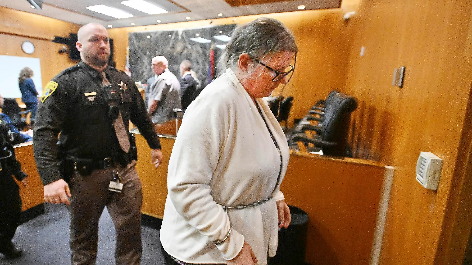 Defendant Jennifer Crumbley exits the courtroom after the jury's unanimous verdict of guilty of involuntary manslaughter on all counts at the conclusion of her trial in the courtroom of Judge Cheryl Matthews at Oakland County Circuit Court in Pontiac, Mich., on Tuesday, Feb. 6, 2024.  (Daniel Mears/Detroit News via AP)