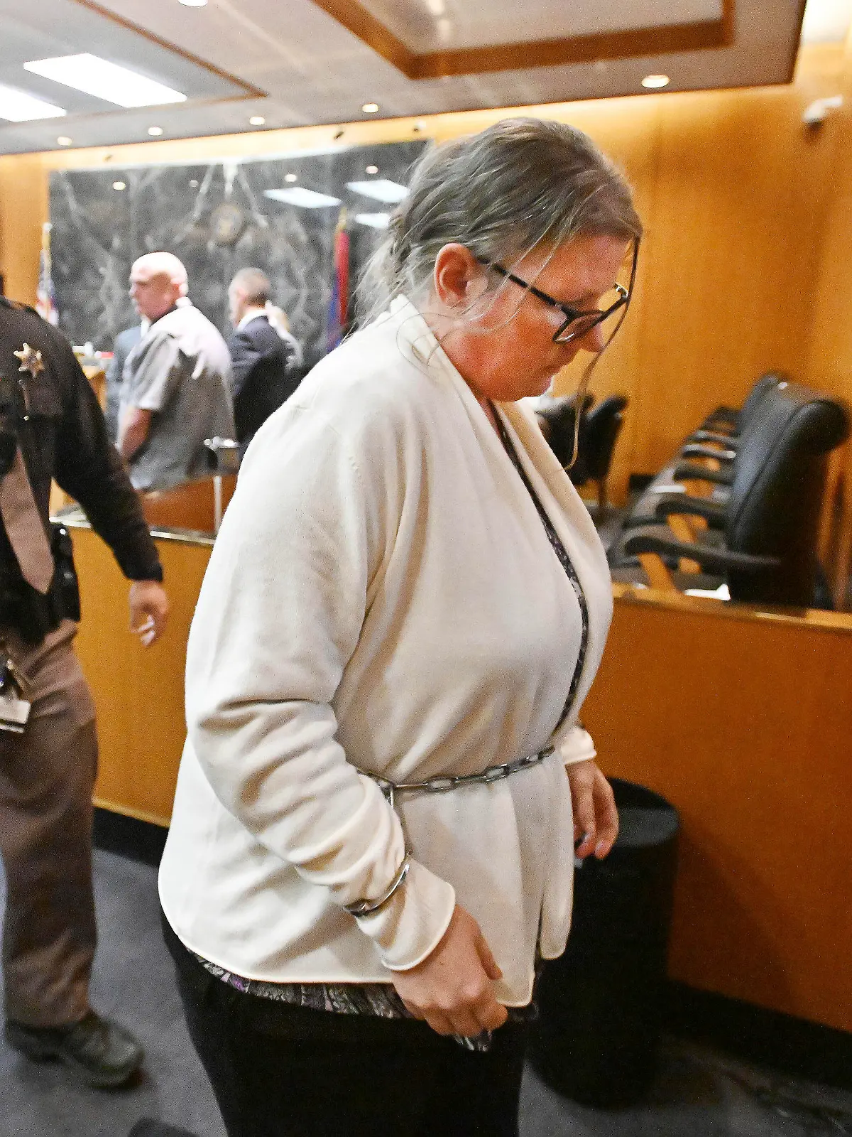Defendant Jennifer Crumbley exits the courtroom after the jury's unanimous verdict of guilty of involuntary manslaughter on all counts at the conclusion of her trial in the courtroom of Judge Cheryl Matthews at Oakland County Circuit Court in Pontiac, Mich., on Tuesday, Feb. 6, 2024.  (Daniel Mears/Detroit News via AP)