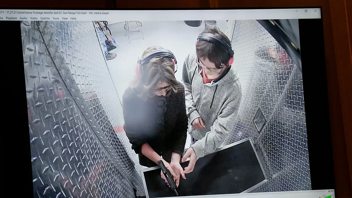 Video showing Jennifer Crumbley, left, with her son Ethan Crumbley at a gun range on Nov. 27, 2021 for target practice, is shown in the courtroom during Jennifer Crumbley's trial, Thursday, Jan. 25, 2024, in Pontiac, Mich. Jennifer Crumbley is charged with involuntary manslaughter in the Nov. 30, 2021, attack at Oxford High School. Prosecutors say she and husband James Crumbley were grossly negligent and that their son's actions were foreseeable. (Mandi Wright/Detroit Free Press via AP, Pool)