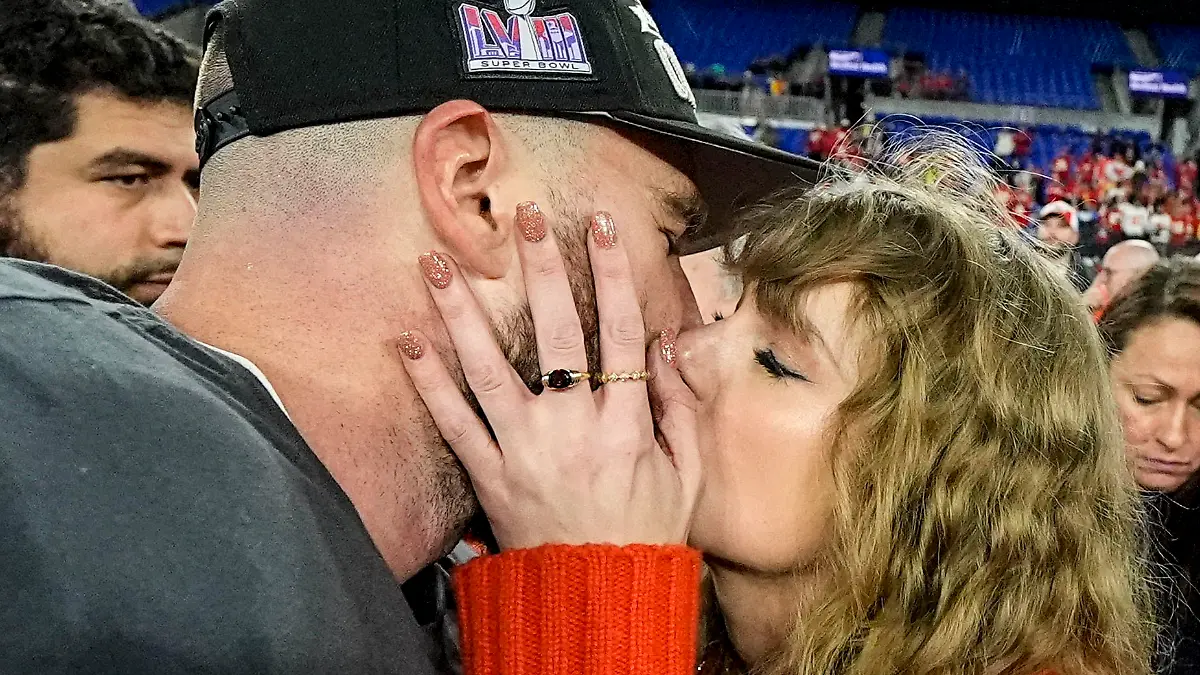 Taylor Swift kisses Kansas City Chiefs tight end Travis Kelce after an AFC Championship NFL football game against the Baltimore Ravens, Sunday, Jan. 28, 2024, in Baltimore. The Kansas City Chiefs won 17-10. (AP Photo/Julio Cortez)