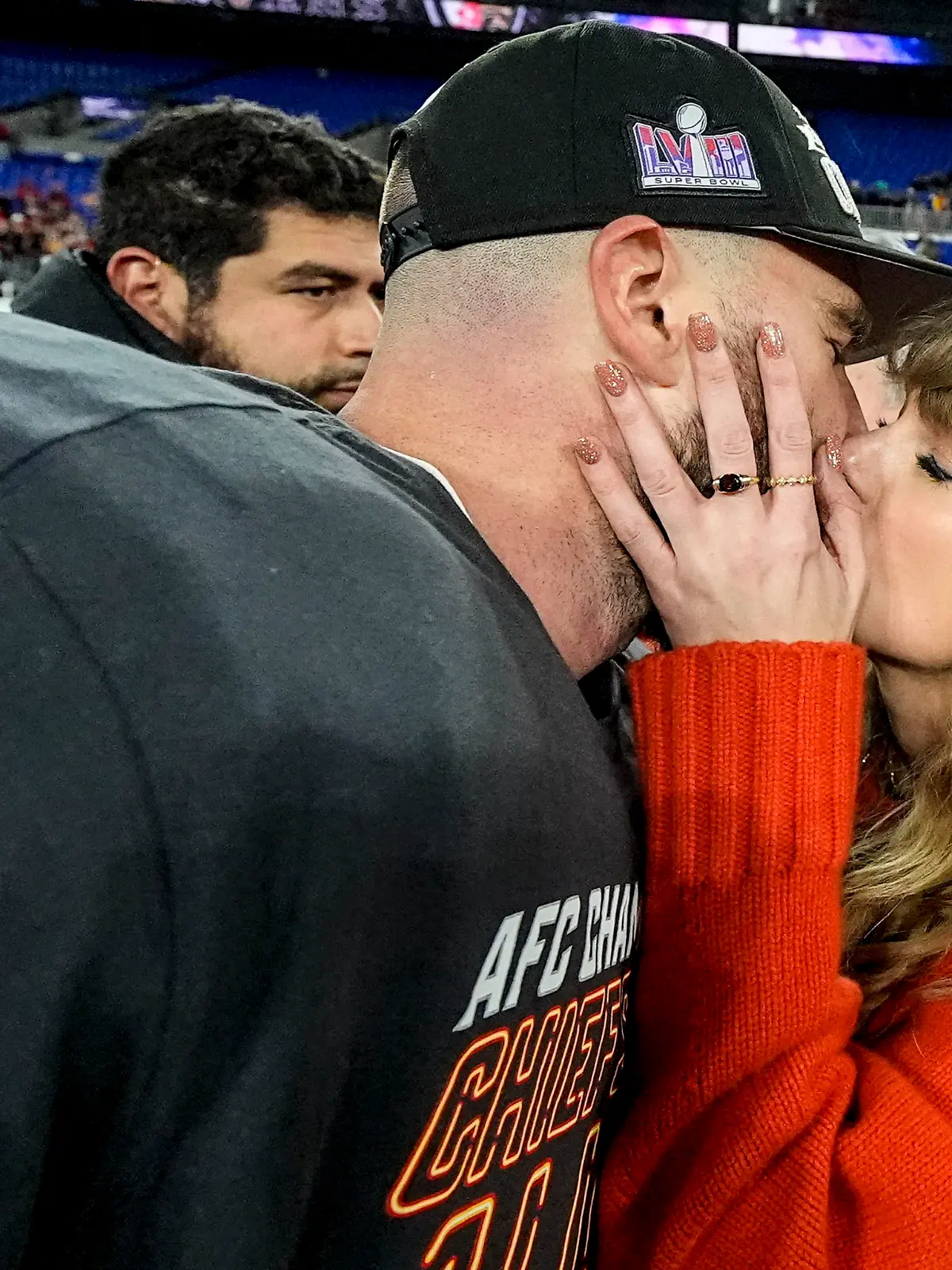 Taylor Swift kisses Kansas City Chiefs tight end Travis Kelce after an AFC Championship NFL football game against the Baltimore Ravens, Sunday, Jan. 28, 2024, in Baltimore. The Kansas City Chiefs won 17-10. (AP Photo/Julio Cortez)