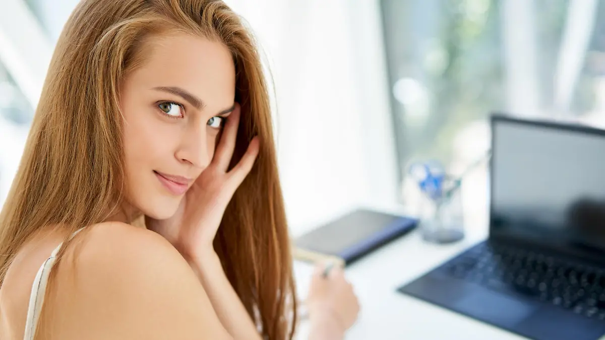 Closeup portrait of pretty businesswoman posing in modern office. Confident female, woman in business, female beauty