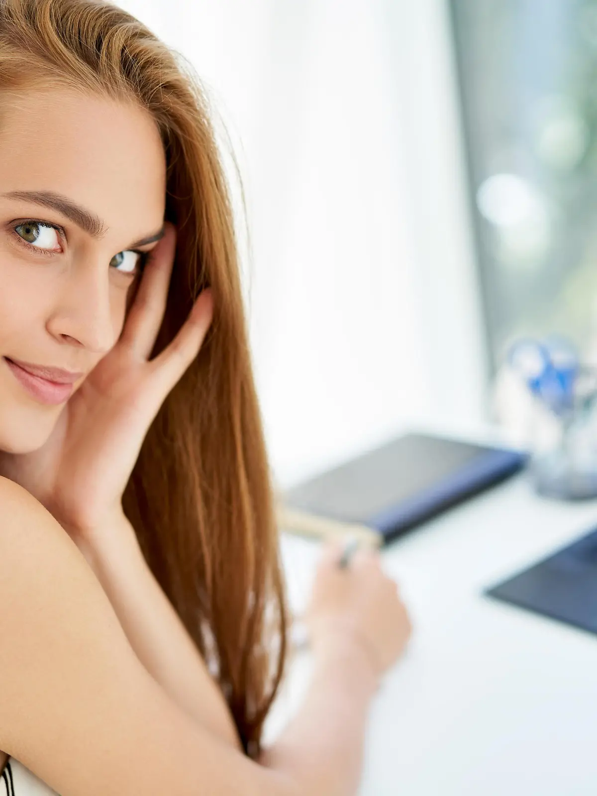 Closeup portrait of pretty businesswoman posing in modern office. Confident female, woman in business, female beauty