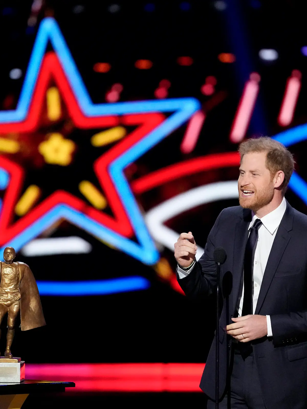 Britain's Prince Harry presents the Walter Payton Man of the Year Award during the NFL Honors award show ahead of the Super Bowl 58 football game Thursday, Feb. 8, 2024, in Las Vegas. The San Francisco 49ers face the Kansas City Chiefs in Super Bowl 58 on Sunday. (AP Photo/David J. Phillip)
