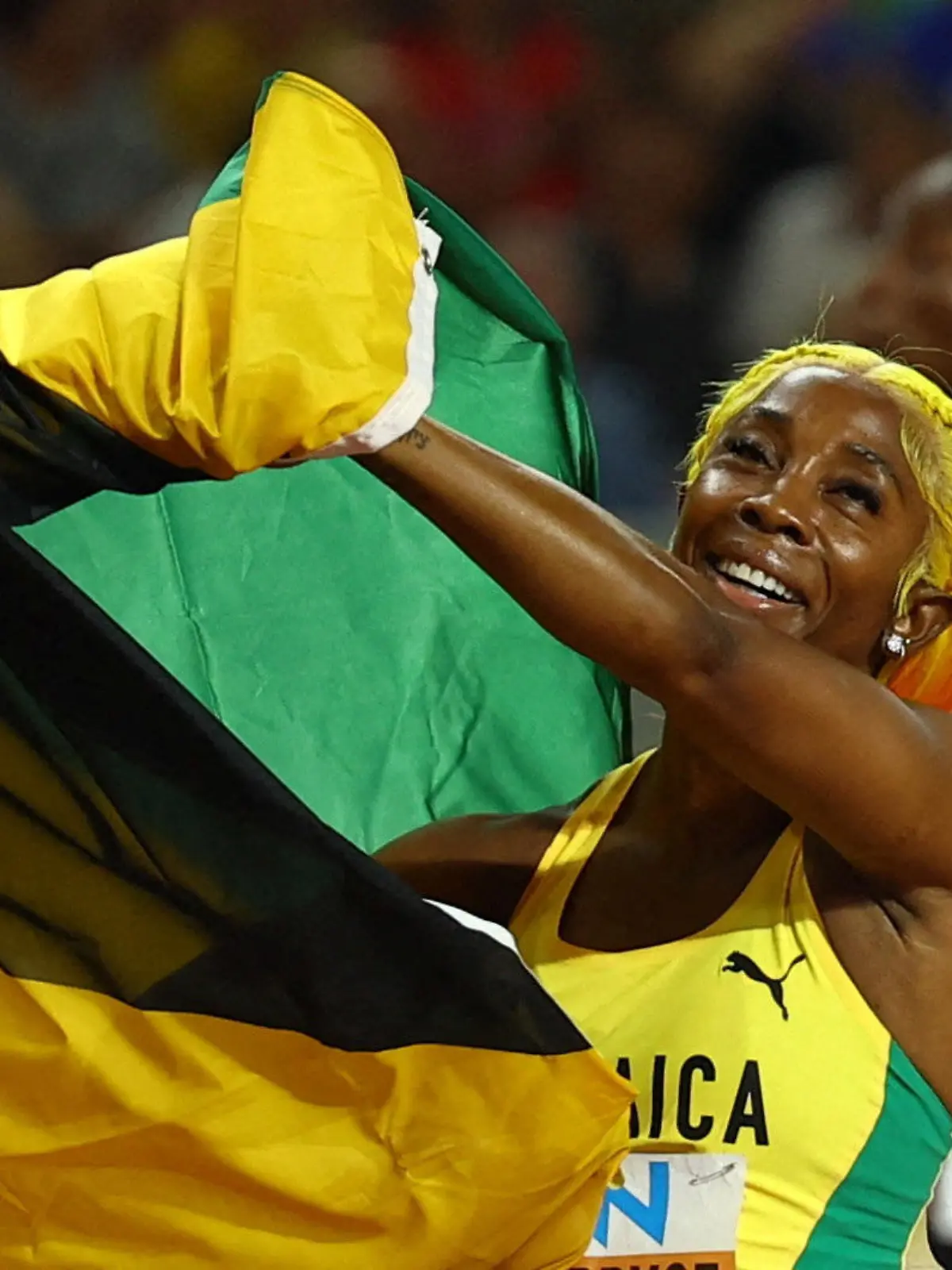 FILE PHOTO: Athletics - World Athletics Championship - Women's 100m Final - National Athletics Centre, Budapest, Hungary - August 21, 2023 Jamaica's Shelly-Ann Fraser-Pryce celebrates after winning bronze REUTERS/Kai Pfaffenbach/File Photo